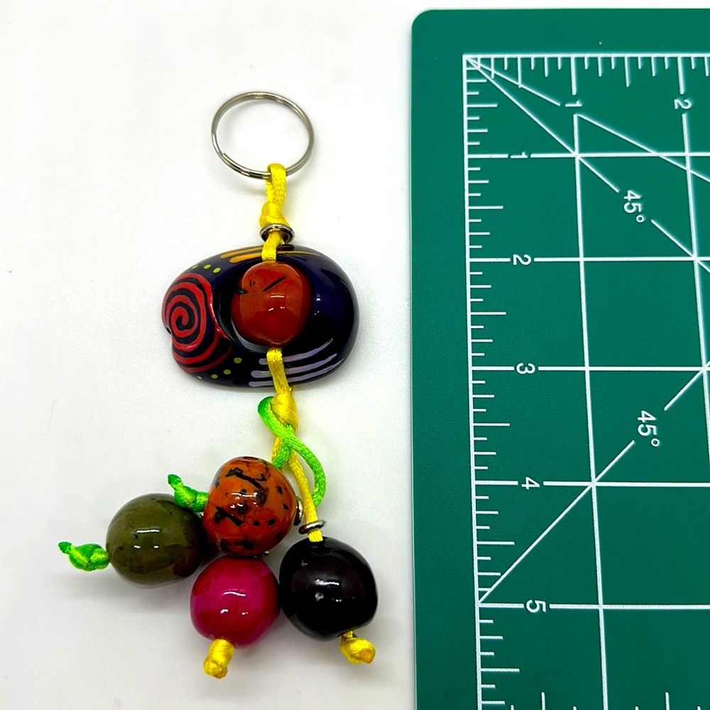 Brand new handmade hand painted key chain. Can be converted to other jewelry.